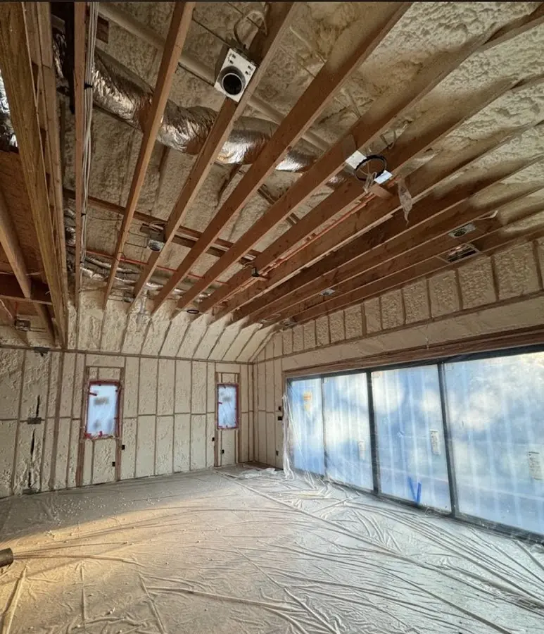 Interior walls and ceiling insulated with spray foam during new construction in Mantua